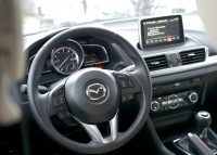 2014 Mazda3 steering wheel and infotainment system.