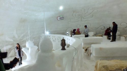 Inside view of igloo cafe with seats covered by sheepskin in Gulmarg.