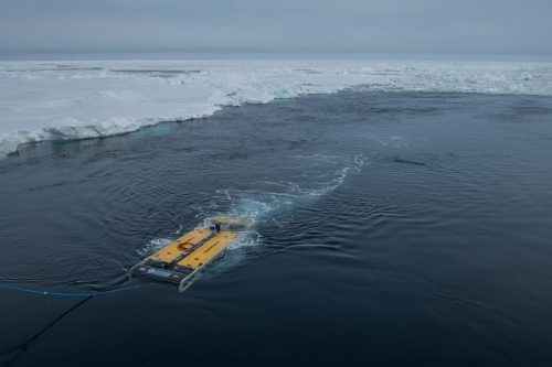 Sabertooth underwater autonomous vehicle in open water near the ice pack after a dive in the Weddell Sea, in search for Sir Ernest Shackleton's ship the Endurance. 2022-02-26.