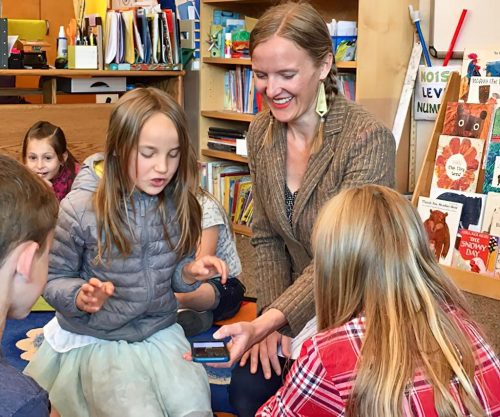 Art teacher Jessica Martin recording a student in class.