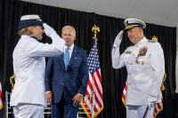 US President Joe Biden looks on as Admiral Linda Fagan relieves Admiral Karl Schultz as the 27th commandant of the Coast Guard during a change of command ceremony at Coast Guard headquarters June 1, 2022. Fagan is the first woman Service Chief of any U.S. military service.