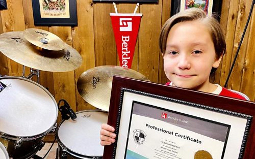 Seba Stephens with his professional certificate from Berklee College of Music.