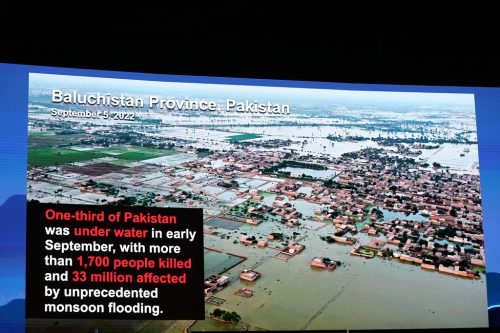 A slide showing flooding in Baluchistan, Pakistan in September, with a printed description of the flood's impact.