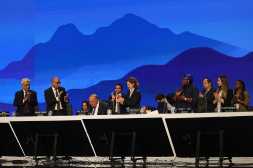 Others on stage applaud as COP27 President and Egyptian Foreign Minister Sameh Shoukry (center) speaks during the closing session of UN climate summit COP27 held in Sharm el-Sheikh, Egypt on November 20, 2022.