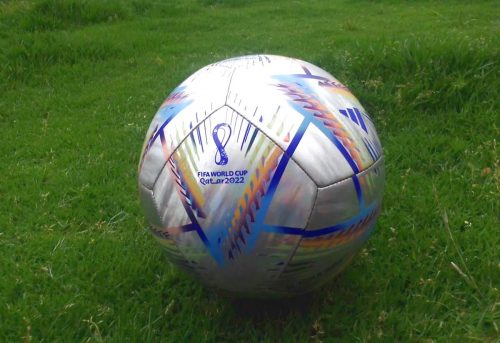 Soccer ball with Qatar World Cup logo.