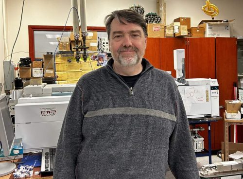 Dr. Paul Mayer, who helped the students with their experiment, shown in his lab.