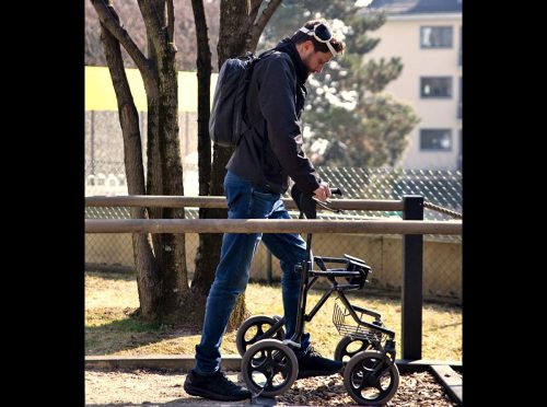 Gert-Jan is shown walking with the digital bridge and a walker.