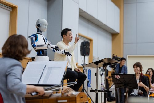 Robot conductor EveR 6 with human conductor Soo-Yeoul Choi.