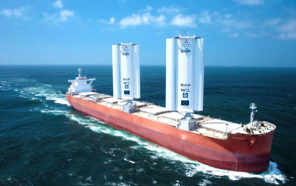 The Pyxis Ocean cargo ship sailing with two WindWings raised.