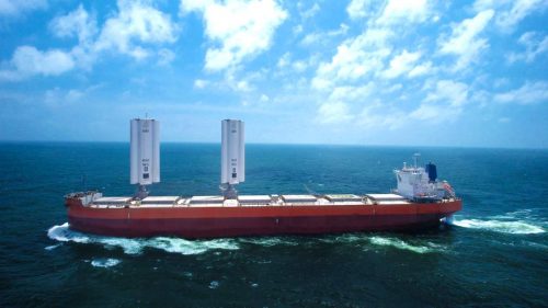 The Pyxis Ocean cargo ship sailing with two WindWings raised.