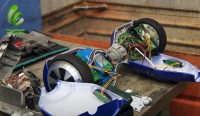 Hoverboard dismantled in Dock, Switzerland, showing electronic components.