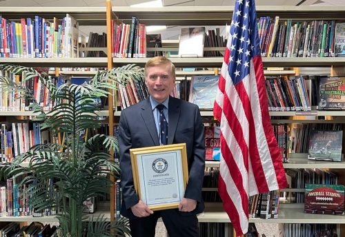 Paul Durietz posedswith his award from Guinness World Records.