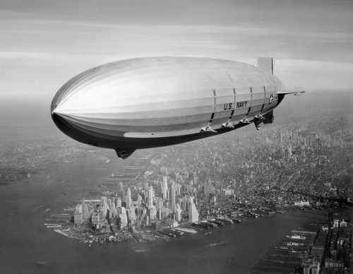 USS Macon (ZRS-5) Flying over New York Harbor, circa Summer 1933. The southern end of Manhattan Island is visible in the lower left center. - NAVAL HISTORICAL CENTER Photo #: NH 43901