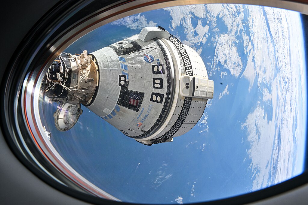 Boeing's Starliner spacecraft that launched NASA's Crew Flight Test astronauts Butch Wilmore and Suni Williams to the International Space Station is pictured docked to the Harmony module's forward port. (July 3, 2024)