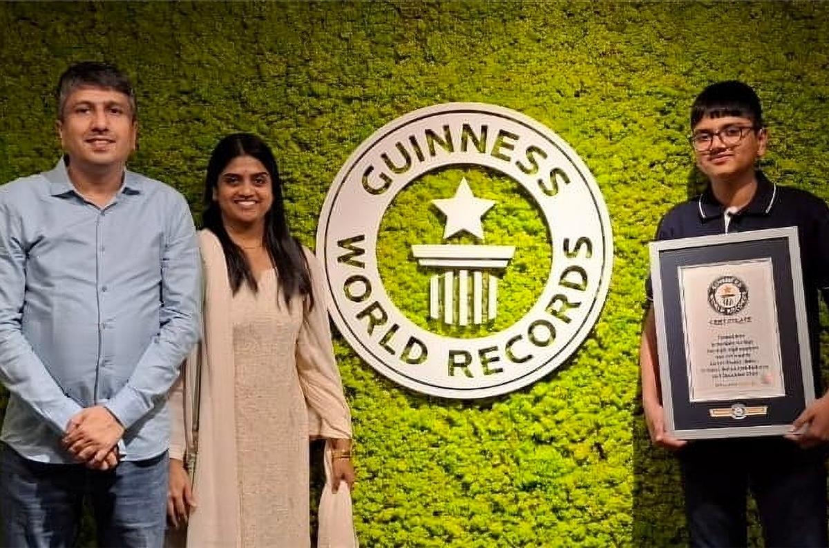 Aaryan and his parents after he set a Guinness World Record in 2024.