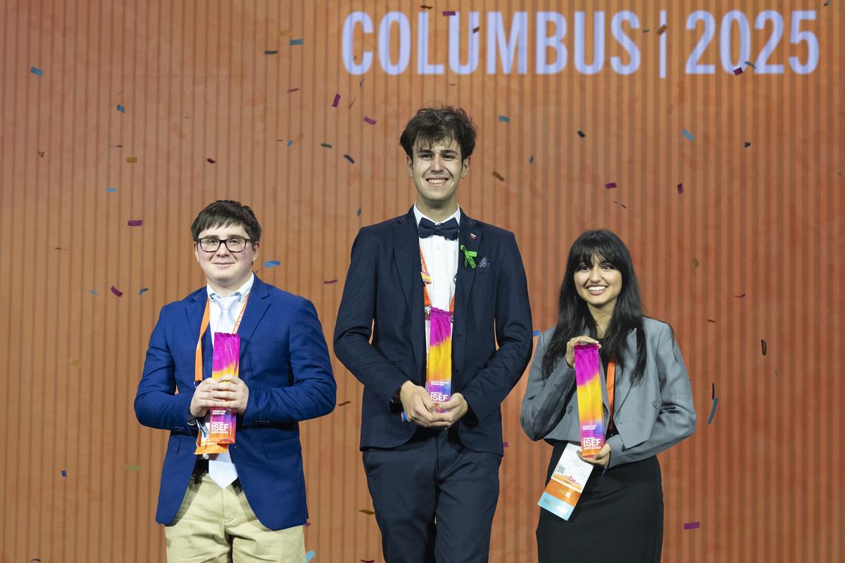 Benjamin Davis, Adam Kovalčík, and Siyaa Poddar with their awards during the 2025 Regeneron International Science and Engineering Fair.