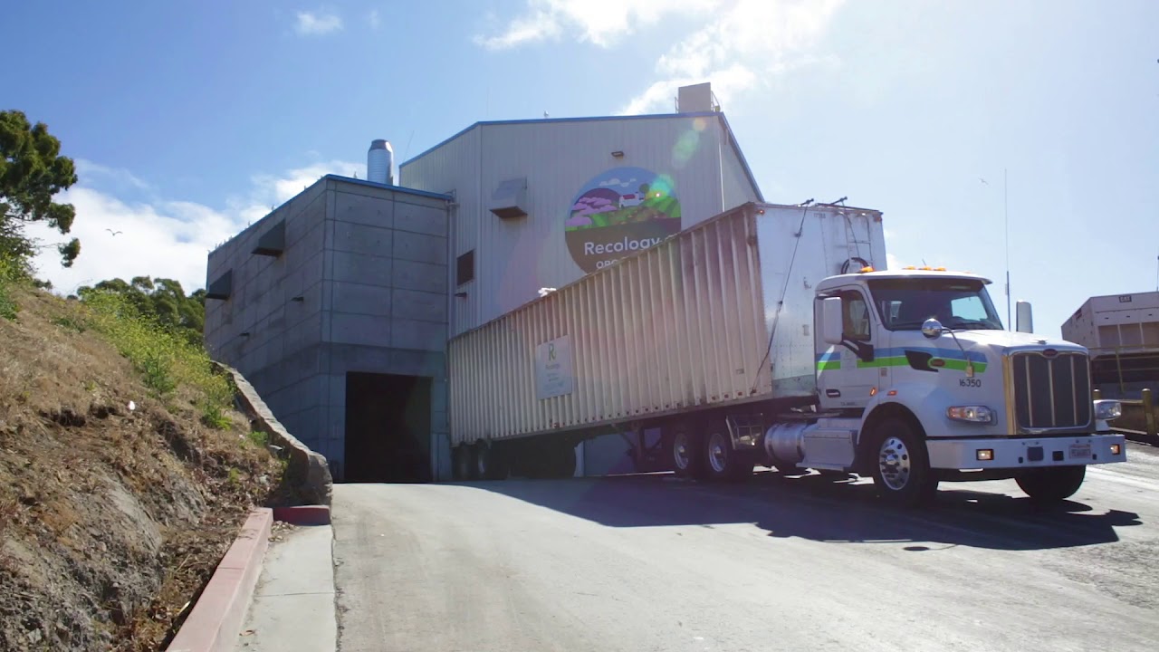 A long-haul transfer truck leaving The West Wing at the Recology's transfer station in San Francisco.