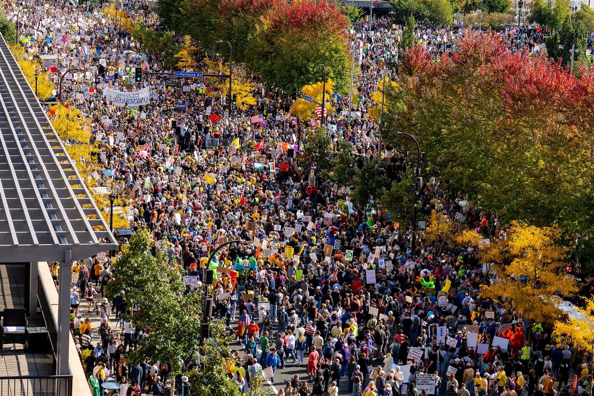 A look down 4th Street at Portland Avenue where protesters have filled the streets. Thousands protest in Downtown Minneapolis on Saturday October 18, 2025 as part of nationwide “No Kings!” protest.
