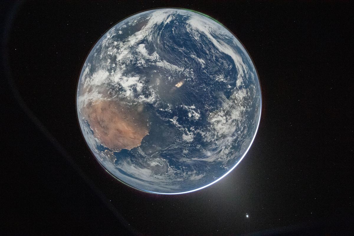 Hello, World NASA astronaut and Artemis II Commander Reid Wiseman took this picture of Earth from the Orion spacecraft's window on April 2, 2026, after completing the translunar injection burn.