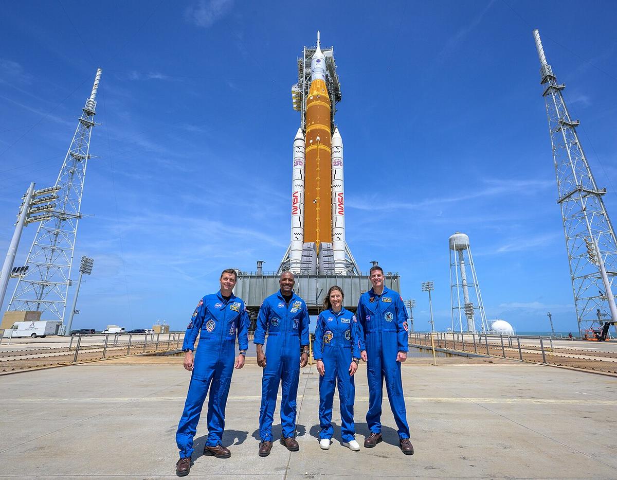 NASA astronauts Reid Wiseman, Artemis II commander, left, Victor Glover, Artemis II pilot, Christina Koch, Artemis II mission specialist, and CSA (Canadian Space Agency) astronaut Jeremy Hansen, Artemis II mission specialist, right, stop for a group photograph as they visit NASA’s Artemis II SLS (Space Launch System) rocket and Orion spacecraft, Monday, March 30, 2026, at Launch Complex 39B of NASA’s Kennedy Space Center in Florida.